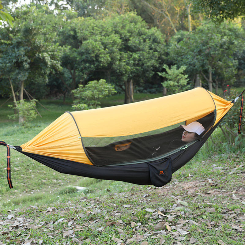 Durable hammock with insect net for camping, hiking, and backyard relaxation